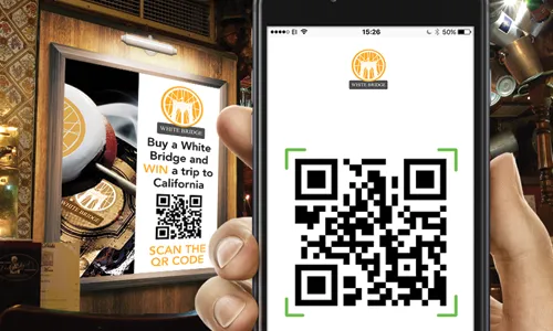 Friends around table with a mobile phone