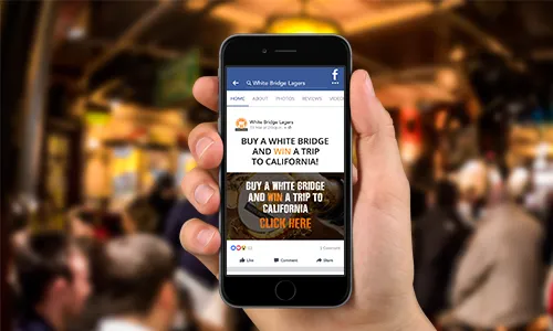 Friends around table with a mobile phone