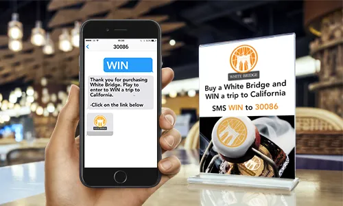 Friends around table with a mobile phone